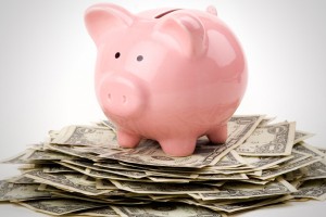 piggy bank on a stack of bank notes