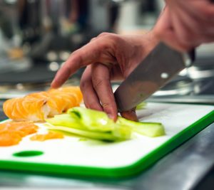 Cutting vegetables on a chopping board