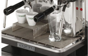 Espresso machine pouring two small cups amnd one tall glass for milk frothing