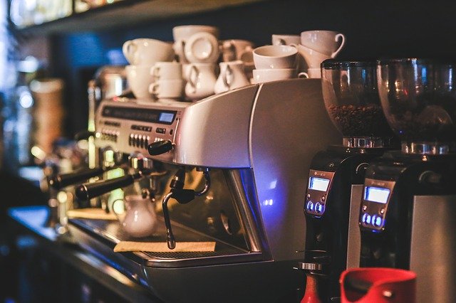Coffee machine with cups and coffee grinders