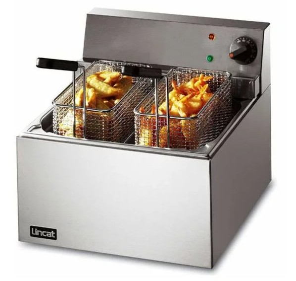 twin tank countertop fryer with two baskets filled with chips