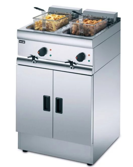 twin tank commercial fryer with two baskets filled with chips 